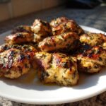 Grilled, juicy pieces of chicken coated in herbs, demonstrating the results of the best 4-hour chicken marinade.