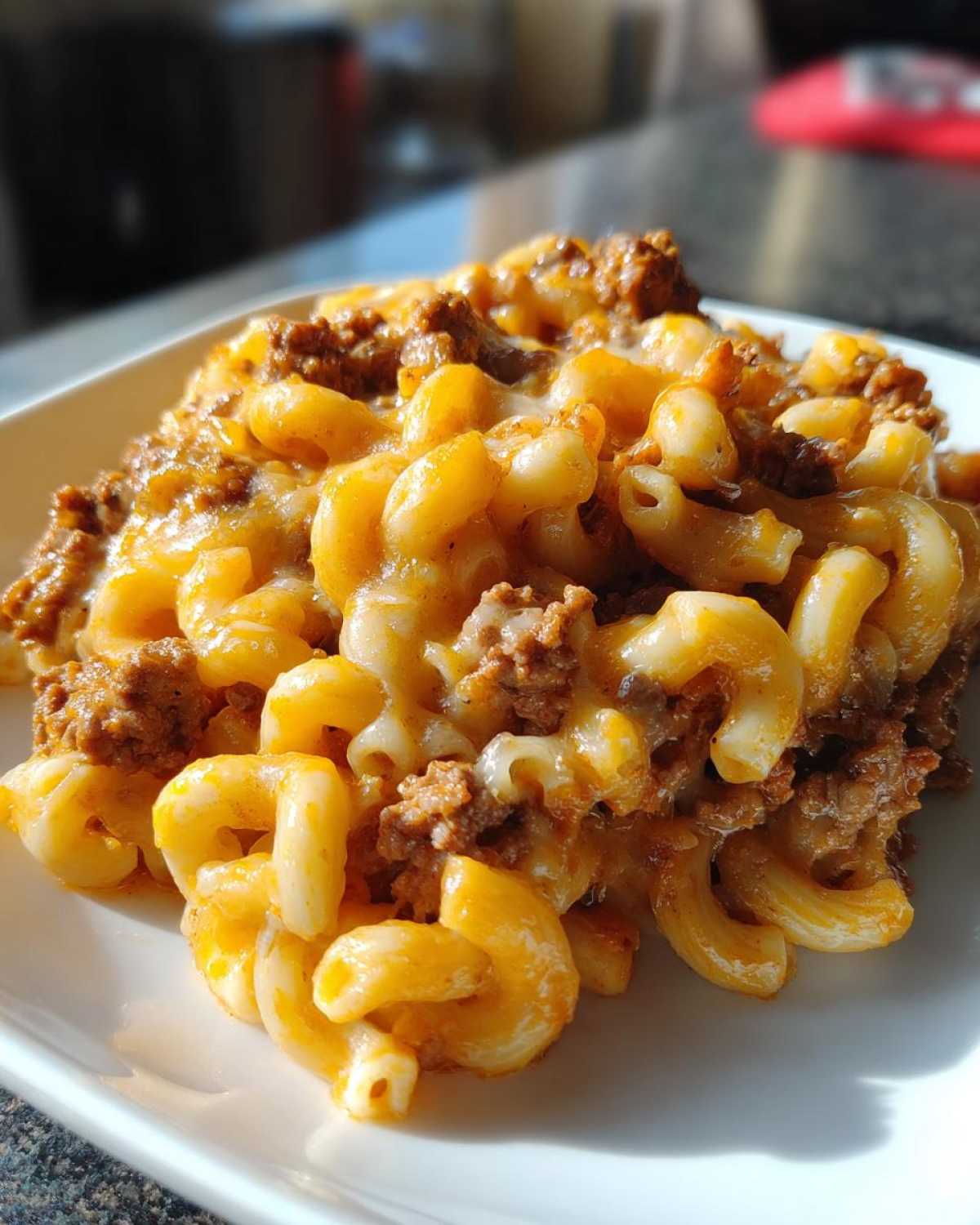 Close-up of Cheesy Ground Beef Pasta with Creamy Sauce featuring elbow macaroni mixed with ground beef and melted cheese.