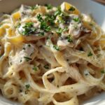 Close-up of rich Creamy Mushroom Chicken Pasta with Parmesan, garnished with fresh parsley.